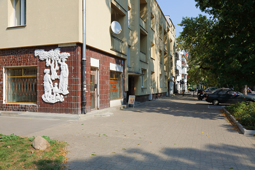 Warsaw, Poland - September 13, 2023: The bas-relief called Plon by Jerzy Jarnuszkiewicz was created on this building after the WWII and can be seen in Saska Kepa. It became a monument in 2011.