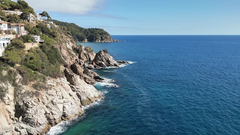 Aerial sea view of beautiful mediterranean coast with cliffs and villas, 4K