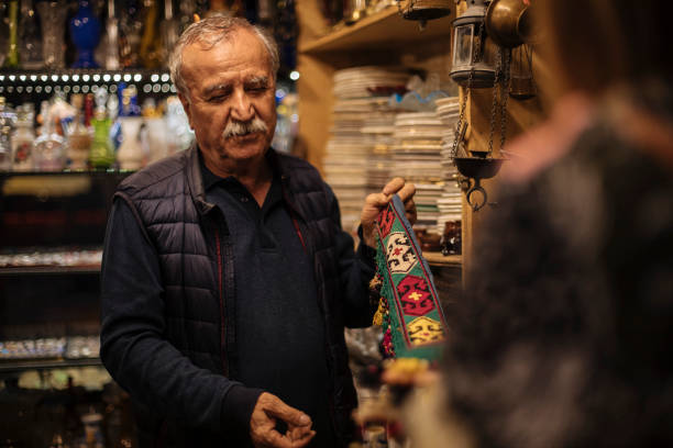 istock Senior gift shop employee 2074305326
