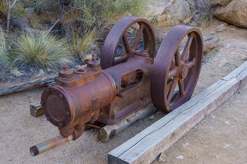 Joshua Tree, California - March 9, 2024: Old antique Chicago Pneumatic Tool Company antique piston air compressor at Desert Queen Mine in Joshua Tree National Park