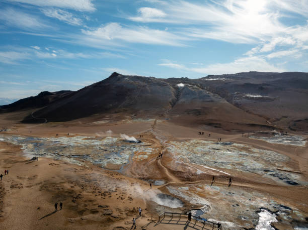 istock Inside a big volcano crater with gray white smoke, aerial view 2074371524