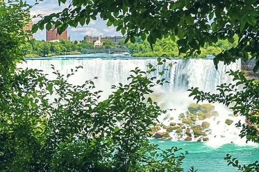 Niagara Falls National Park, Ontario, Canada. Beautiful view from behind trees of the Niagara Falls.