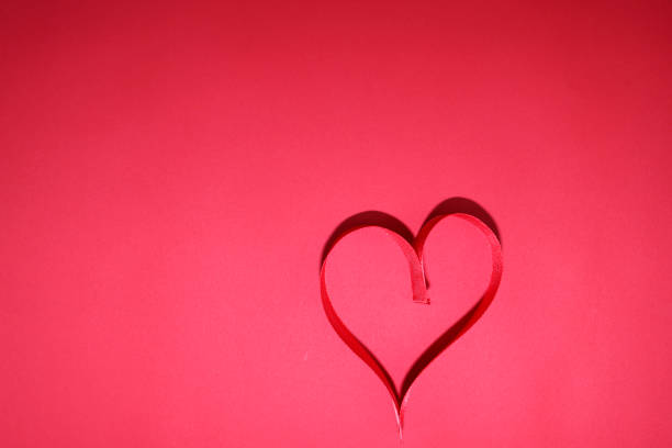 Red ribbon in heart shape