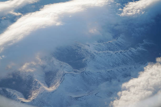 aerial view of snow mountains range from airplane