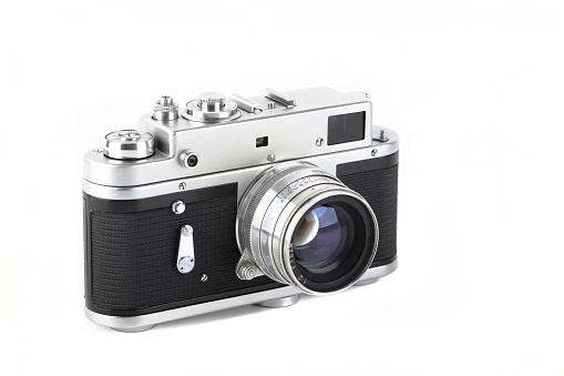 Vintage rangefinder camera 70s on white background.