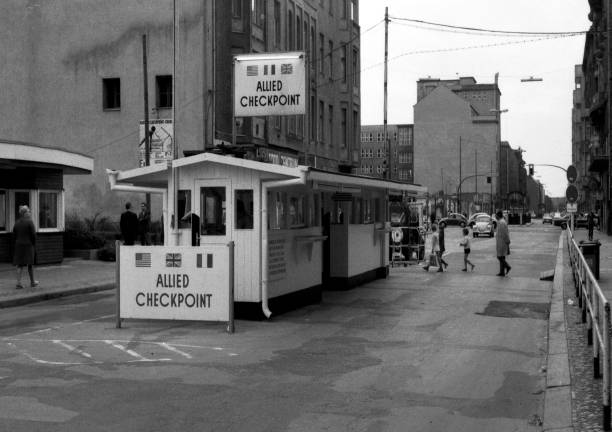 Checkpoint Charlie in Berlin - Germany.. Allied border crossing Checkpoint Charlie on Friedrichstrasse in Berlin. soldier on the wall stock pictures, royalty-free photos & images