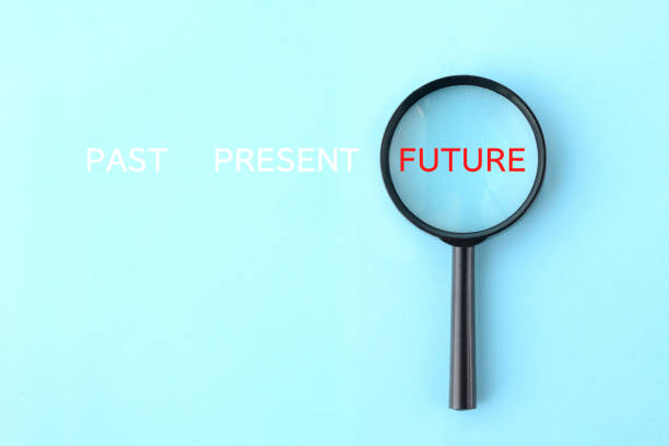 istock Magnifying glass with PAST, PREAENT and FUTURE word 2074570953