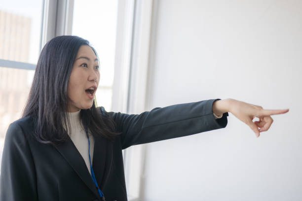 istock Pointed business woman 2074571559