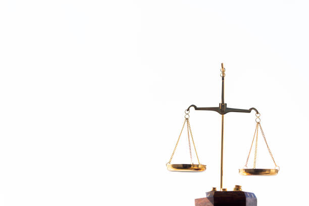 Scales of justice on sky background