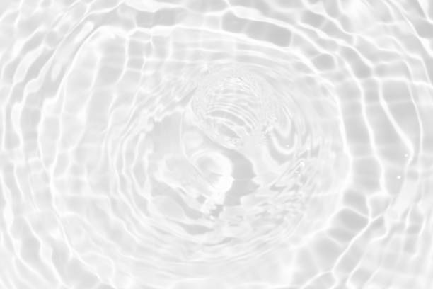 istock White water surface texture with ripples, splashes, and bubbles. Abstract summer banner background Water waves in sunlight with copy space cosmetic moisturizer micellar toner emulsion. White water. 2074618375
