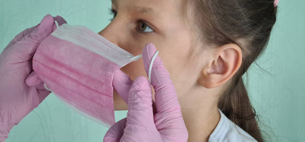 Middle-aged female doctor with a medical mask in the clinic, close-up. Prison Hospital. Psychiatric Hospital.