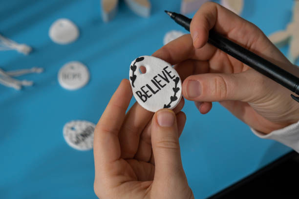 istock Workshop writing word BELIEVE on EASTER clay egg Children air dry clay activity handicraft idea. DIY process step by step instruction. Preparing for Easter holiday decorating. Modern organic design minimalistic plastic free sustainable 2074808865