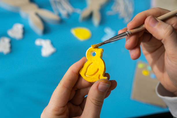 Master class of coloring Children air dry clay activity handicraft idea. DIY process step by step instruction. Preparing for Easter holiday decorating. Modern organic design minimalistic plastic free sustainable decor
