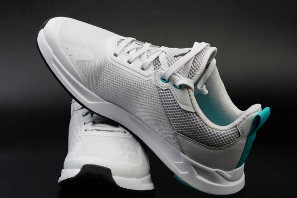 istock Pair of white shoes with laces 2074816260