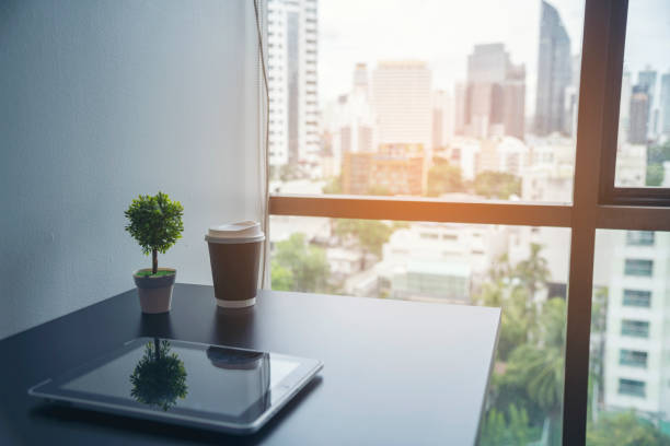 istock Top view office desk laptop and coffee cup on wood table copy space. Tabletop notebook laptop coffee cup for officer display empty space on wooden background. Home business work from home workspace 2074816262