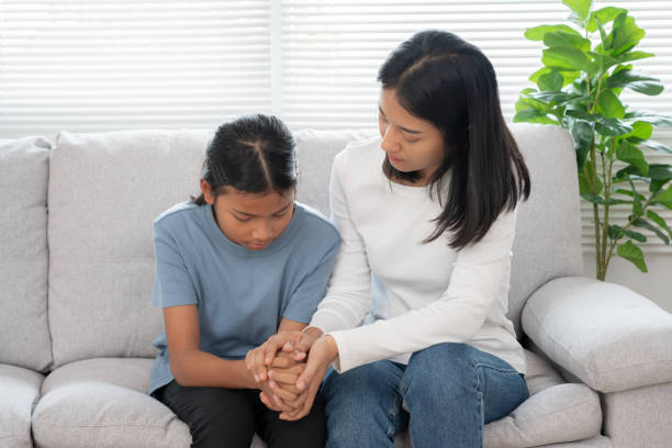 istock asian mother support daughter discussing study problems. Parent encourages and empathy child suffers depression. psychological, trust, care, cry, expectation, teen problems, bullying, learn problem 2074824754