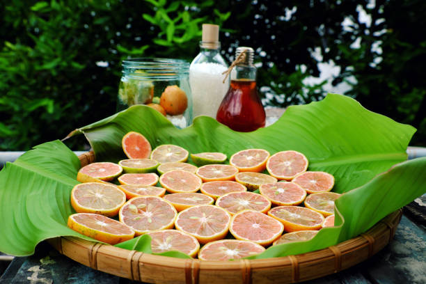 Raw material to make beverage for hot summer on green background, organic pink lemon, sweet honey and sugar, set herbal medicine to health care by rich vintamin c