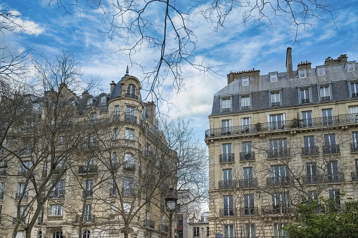 View of Montmartre rooftops and glimpse of the Lapin Agile. Lapin Agile is a famous Montmartre cabaret, at 22 Rue des Saules, 18th arrondissement of Paris, France. The venue existed circa 1860 under the name Au rendez-vous des voleurs, meaning \