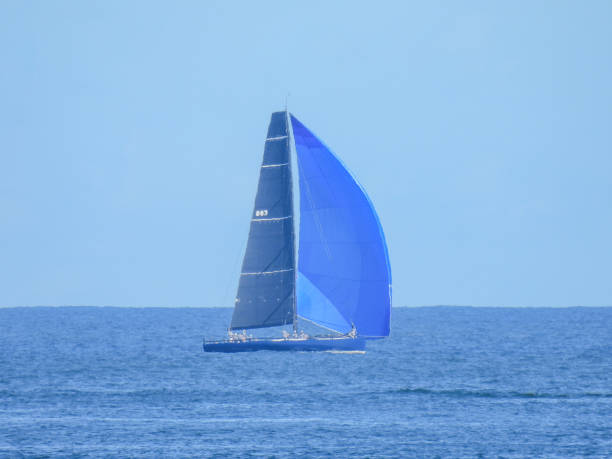 blue water sailing - sea water single object sailboat fotografías e imágenes de stock