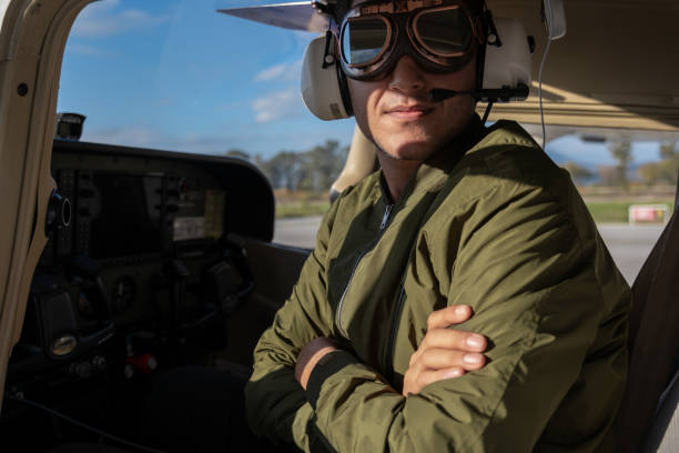 young pilot candidate receiving flight training meets with the tower - avionics flying training cockpit imagens e fotografias de stock