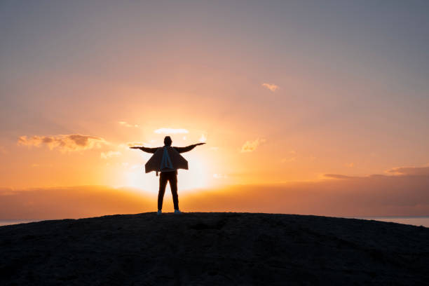 istock Young man flies with jetPack chasing his dreams on the beach 2074891522