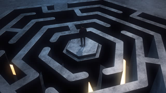 Businessman standing at the beginning of a maze