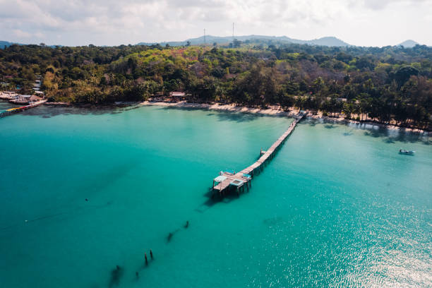 istock Wooden bridge at the beach and clear blue water 2074903142