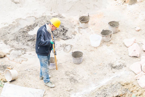 istock Worker repairing shovel on construction site 2074924222