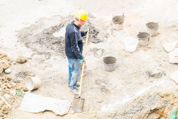 istock Worker repairing shovel on construction site 2074924738