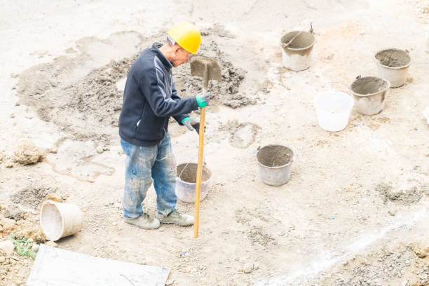 istock Worker repairing shovel on construction site 2074925257