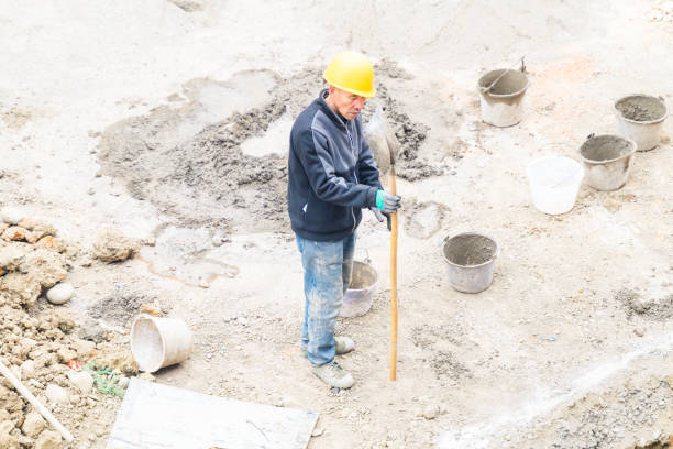 istock Worker repairing shovel on construction site 2074925258