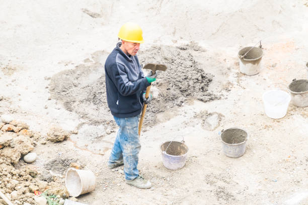 istock Worker repairing shovel on construction site 2074925781