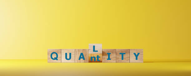 istock Dice form the words QUALITY or QUANTITY on wooden cube block for business start up concept. 2074935770