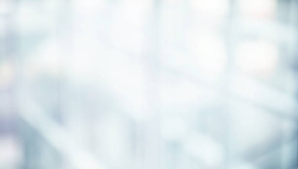istock Blurred abstract glass wall from building in city town background. 2074936831