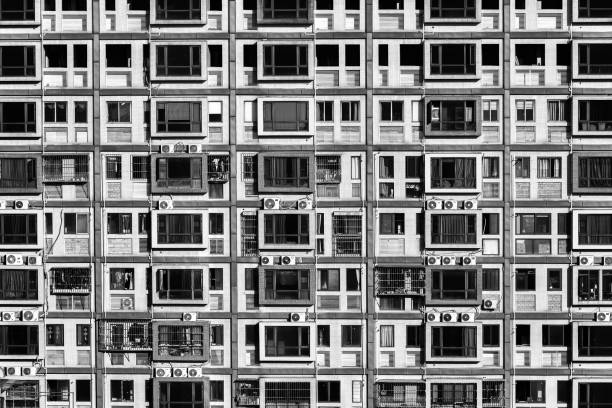 Huge overcrowded block of flats in Singapore, repeated windows in the shape of an infinite pattern