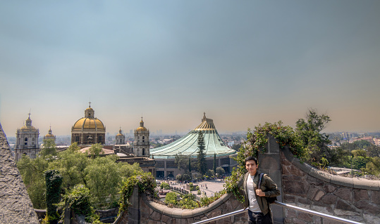 Man standing in the Basilica of Our Lady of Guadalupe, Mexico City
