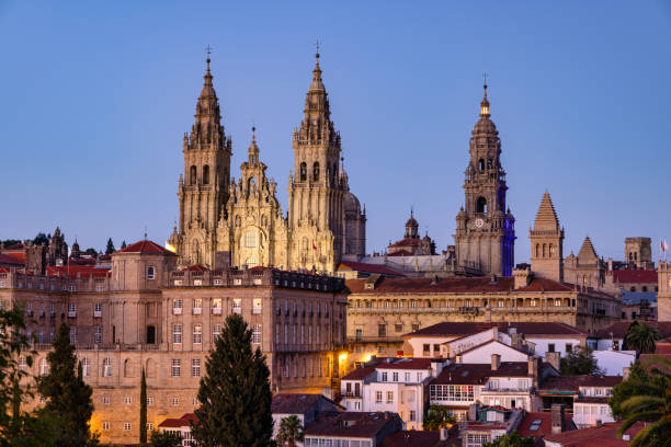 Santiago de Compostela Cathedral at Dusk. Illuminated City of Santiago de Compostela with famous Cathedral in Night Twilight. Overlooking the Santiago Cityscape towards the famous Cathedral. Santiago de Compostela, Galicia, Spain, Europe