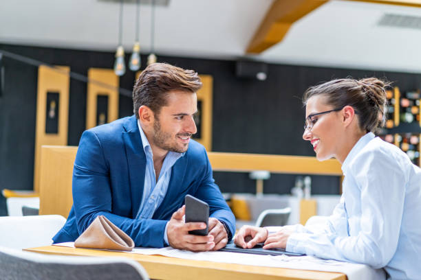 istock Coworkers talking and working in restaurant 2074985756