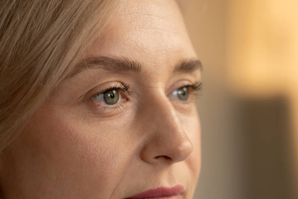 istock Close-Up View of a Womans Face Capturing Detail and Expression During Daylight 2074988449