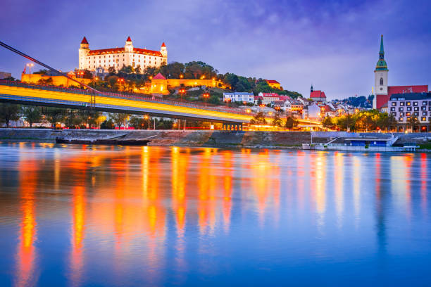 Bratislava, Slovakia. Bratislava Castle and old town over Danube River. Bratislava, Slovakia. Bratislava Castle and old town over Danube River, twilight sunset. bratislava castle bratislava castle fort stock pictures, royalty-free photos & images