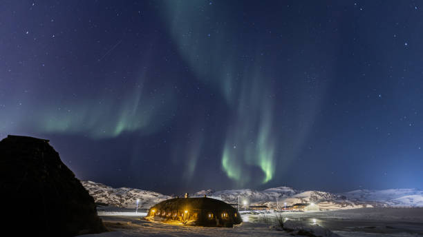 istock Northern lights with winter landscape. 2075048043