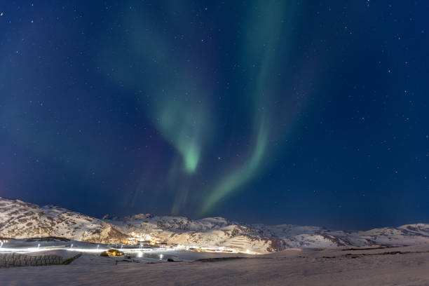 istock Northern lights with winter landscape. 2075048047