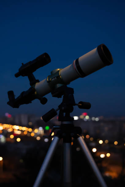 istock Astronomical telescope for observing stars, planets, Moon, celestial objects. Observing sky from urban light polluted area. 2075075565