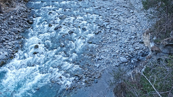 Rocks in stream with smooth flowing water