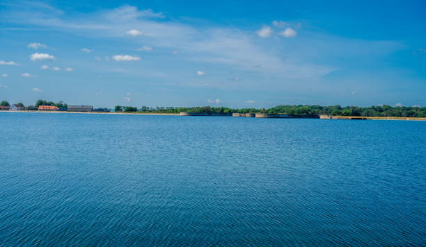 istock Blue sea with forest on the coast. Blue sky with white clouds. 2075087656