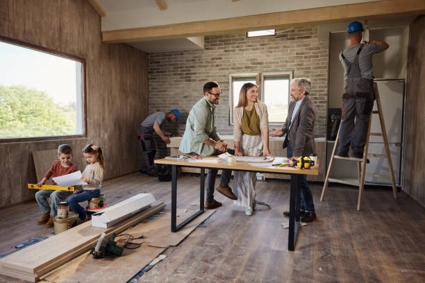 istock Happy parents talking to an architect during home renovation process. 2075090411