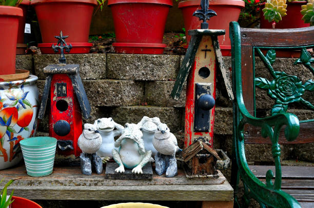 Two decorative ceramic frogs.