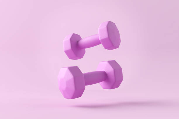 istock Pink dumbbells levitating on pink background with copy space. 2075108597