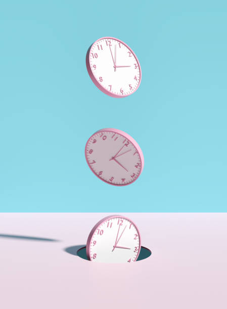 istock Wall clocks falling through a hole on pink and blue background. 2075108622