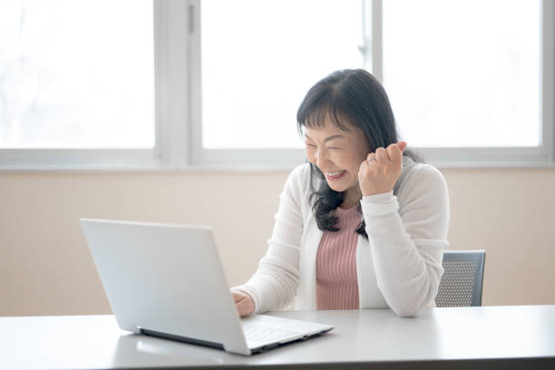 istock business woman happy 2075110223